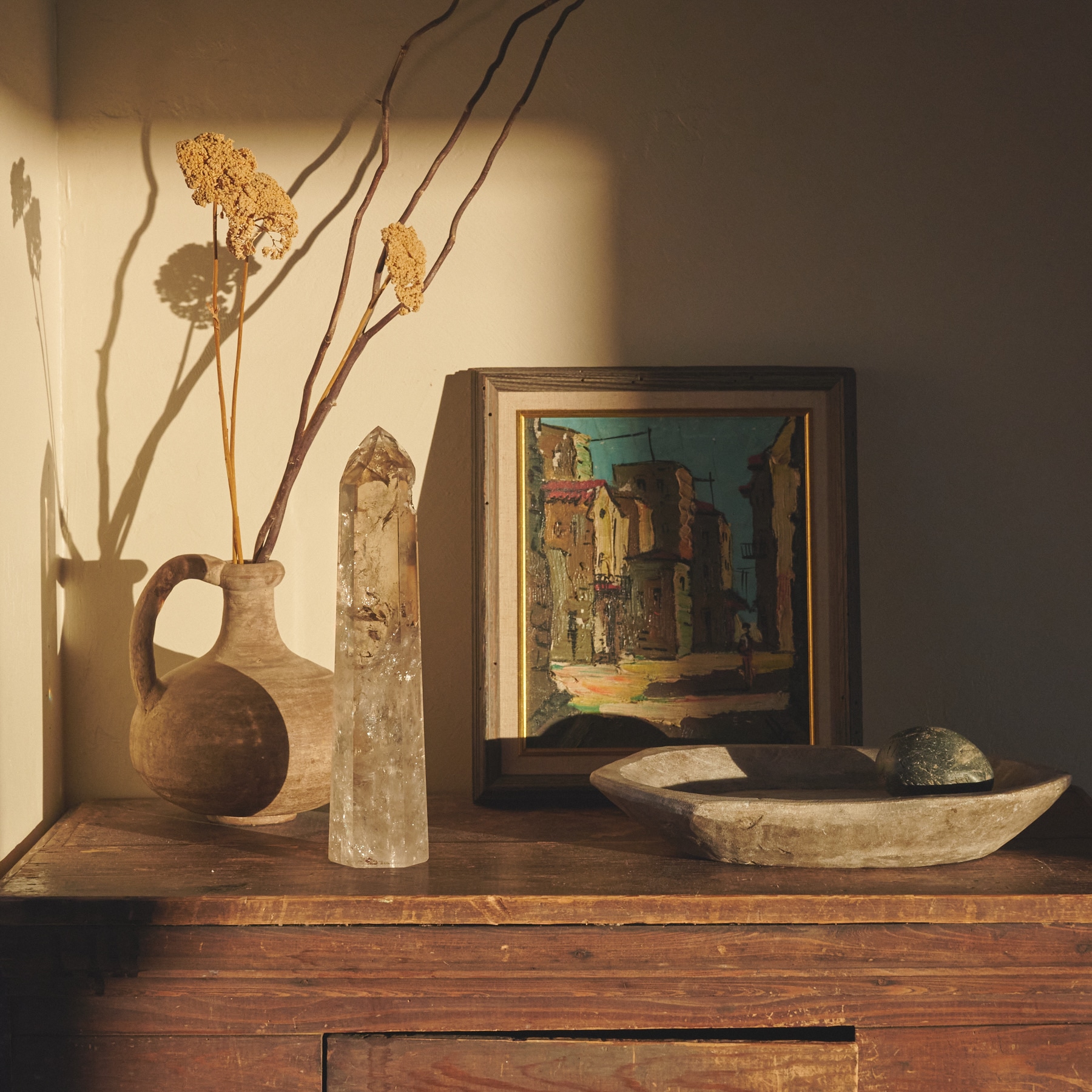 Still life photography by Brittany Roughton, crystal point with vintage painting, ceramic vase, dried flowers